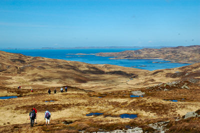 Picture of walkers approaching Loch Tarbert on the Isle of Jura