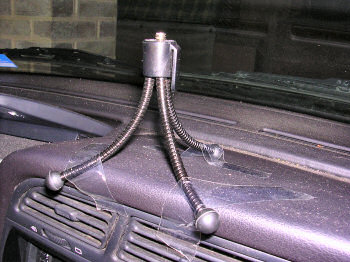 Picture of a tripod taped to a dashboard